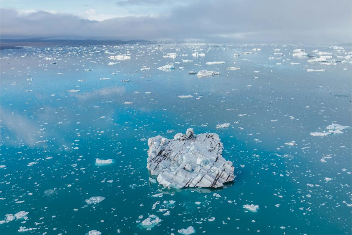 Aerial view of iceberg in the stunning Jökulsárlón Glacier Lagoon, Iceland. Ideal for nature and travel imagery.