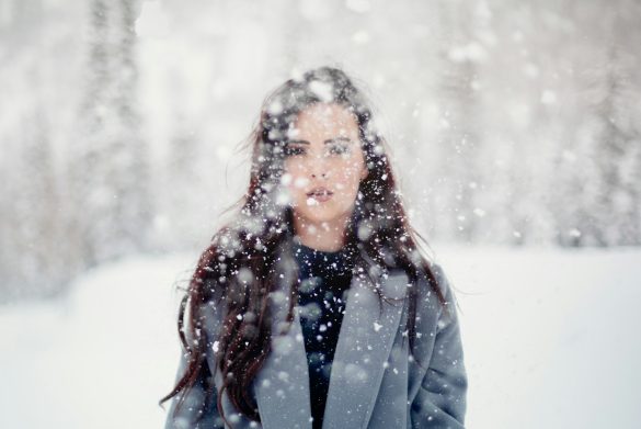 selective focus photograph of woman in gray coat