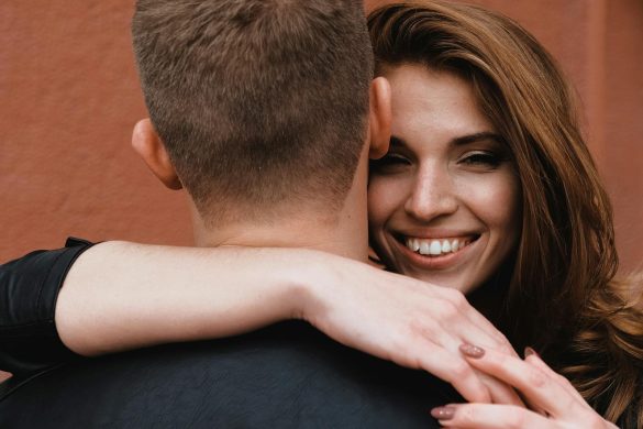 A close-up of a couple embracing, highlighting affection and happiness.