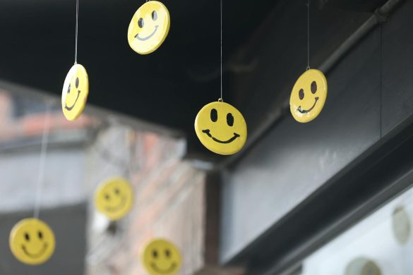 Cheerful yellow smiley faces hanging outside, creating a joyful atmosphere.