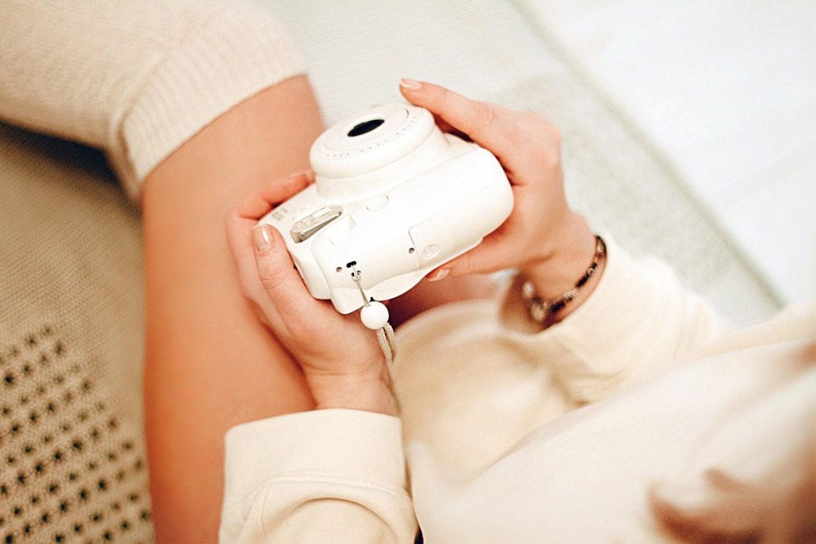 thigh high socks, polaroid camera, woman, cozy, legs