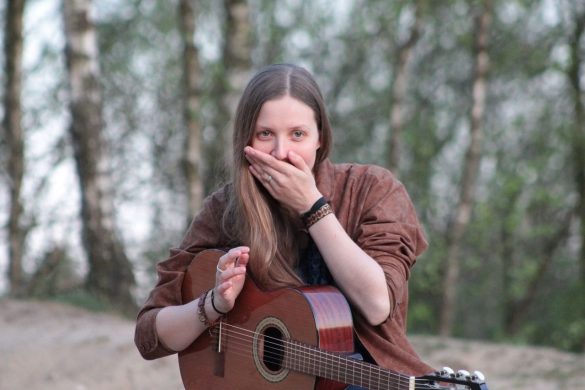 young woman, surprised, long hair, guitar, forest, trunks