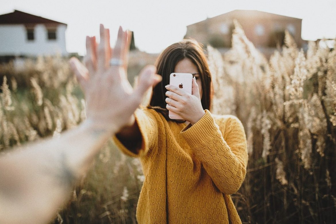 people, woman, couple, ring, hands, yellow, sweater, field, house, iphone, cellphone, brown house, brown field, brown iphone, couple, couple, sweater, sweater, sweater, sweater, sweater, cellphone, cellphone, cellphone, cellphone